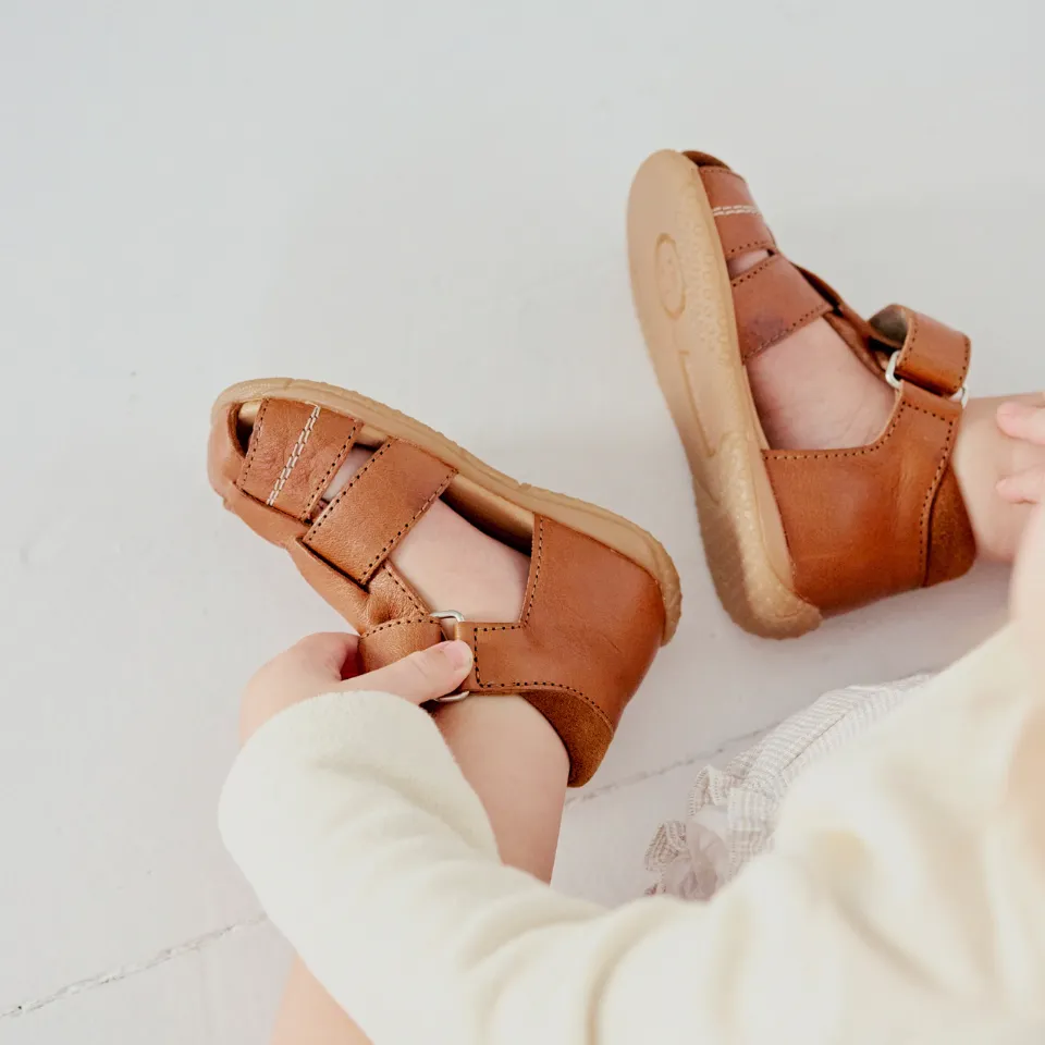 The child's first sandal with contrast stitching